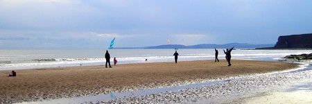 [Kite flying on the beach]