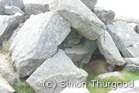 [Some of the waste rock by the quarry]